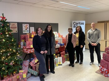 Vertreter:innen der Caritas, RBI AG und Valida